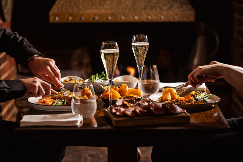 People eating food at The Hind's Head, Bray